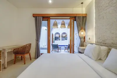 a bedroom with a large white bed and a desk at T&J4 - Romantic 1BR pool villa, walk to beach in Umalas