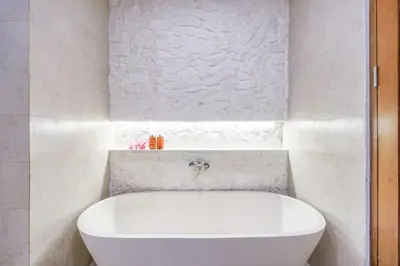 a white bath tub in a white bathroom at T&J6 - Gorgeous 1BR pool villa, walk to beach! in Umalas