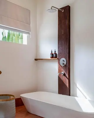 a white bath tub in a bathroom with a window at Villa Belle Oasis - Next To Canggu 5BR Tropical Paradise with Private Pool & Stunning Rice Field Views in Kerobokan