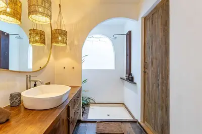 a bathroom with a sink and a mirror at Villa Belle Oasis - Next To Canggu 5BR Tropical Paradise with Private Pool & Stunning Rice Field Views in Kerobokan