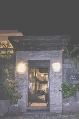 a small brick building with a window and lights at Le Retreat Canggu, 3BR Luxury Villa, Bali's Best Location in Canggu