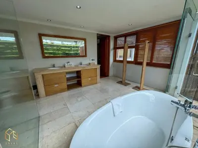 a large bathroom with a tub and a sink at Party Size 4 Bedroom Villa Kerobokan in Seminyak