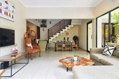 a living room with a couch and a table at Kefi Villa Seminyak in Seminyak