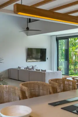 a dining room with a table and chairs at Casa Kameelya - Modern Tropical 4BR Villa in Central Canggu in Canggu