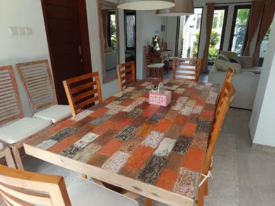 a dining room table with a tablecloth on it at Casa Dijaweqo in Jimbaran