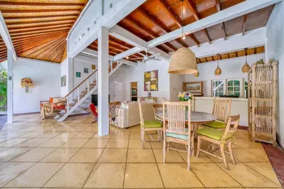 a kitchen and dining room with a table and chairs at Villa Sabi 3BR in the Heart of Seminyak by Santi Management in Seminyak