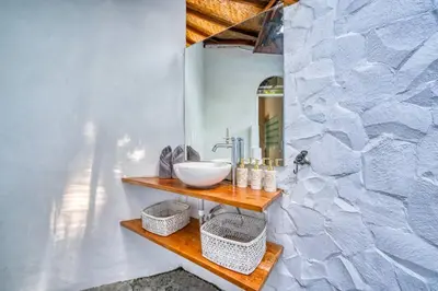 a bathroom with a sink and a mirror at Villa Sabi 3BR in the Heart of Seminyak by Santi Management in Seminyak