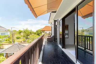 a balcony with a view of a house at Villa with private pool in Nusa Dua in Nusa Dua