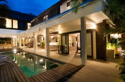 an external view of a villa with a swimming pool at 5BR Villa Sabtu - Minggu Villas Seminyak in Seminyak