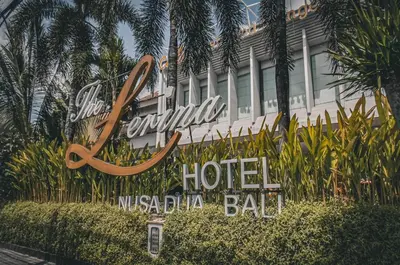 a sign for a hotel in front of a building at The Lerina Hotel Nusa Dua in Nusa Dua