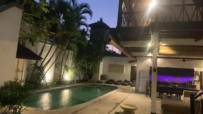 a swimming pool in the backyard of a house at Villa Gardenia - 6 Bedrooms with Pool in Seminyak in Seminyak