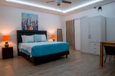a bedroom with a bed and a desk in it at Altea Villa Legian - 2BR Private Pool, Prime Location & Walk to Beach in Legian