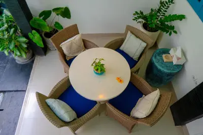 a table in a room with chairs and pillows at Altea Villa Legian - 2BR Private Pool, Prime Location & Walk to Beach in Legian