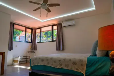 a bedroom with a bed and a ceiling fan at Altea Villa Legian - 2BR Private Pool, Prime Location & Walk to Beach in Legian
