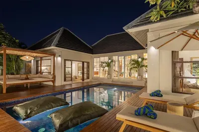 a villa with a swimming pool at night at Villa Dalon by Optimum Bali Villas in Seminyak