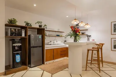 a kitchen with a stainless steel refrigerator and a counter at Villa Dalon by Optimum Bali Villas in Seminyak