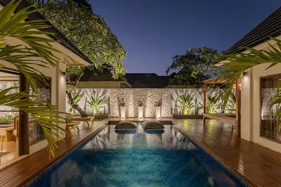 a swimming pool in a villa at night at Villa Dalon by Optimum Bali Villas in Seminyak