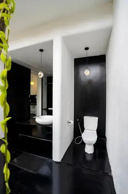 a bathroom with two sinks and a toilet at Villa bella vista in Seminyak