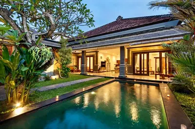 an image of a swimming pool in front of a house at Bens Tunjung Villa Two-Bedroom with Private Pool Kuta in Seminyak