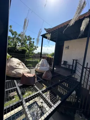 a bird cage with covers on top of it at Nawasena Suites in Sanur