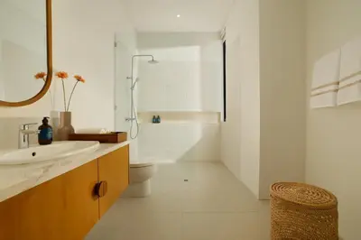 a bathroom with a sink and a toilet and a shower at Villa Kalem Canggu by Nakula in Canggu