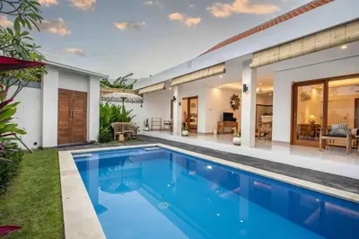 a swimming pool in the backyard of a house at Bens Mertanadi Villa Two-Bedroom with Private Pool Kuta in Seminyak