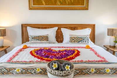 a bed with a heart made out of flowers at Arts Biyu Villa Two-Bedroom with Private Pool Kuta in Seminyak