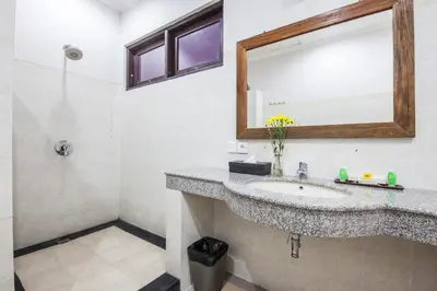 a bathroom with a sink and a mirror at 4-BR Private Pool Legian Villa, 5-min walk to beach and shops in Seminyak