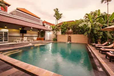 a swimming pool in the middle of a house at 8-BR Private Pool Legian Villa 5-min Walk to Beach and Shops in Seminyak