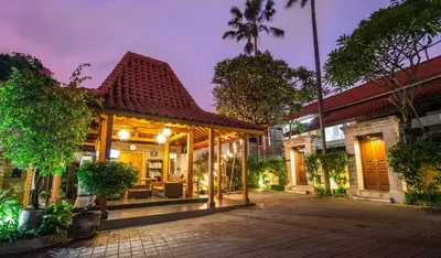 a house with a pavilion in a city at night at 7-BR Private Pool Legian Villa 5-Min Walk to Beach and Shops Bali in Seminyak