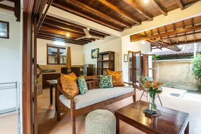 a living room with a couch and a table at 6-BR Garden Legian Villa 5-Min Walk to Beach and Shops Bali in Seminyak