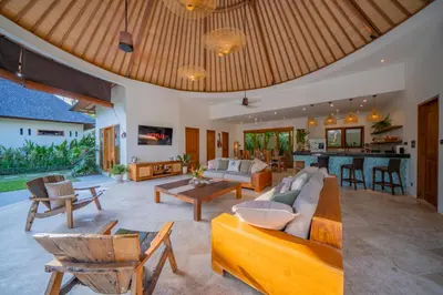 an open living room with a couch and a table at Villa Lea - 5BR luxury oasis in Seminyak with pool in Kerobokan