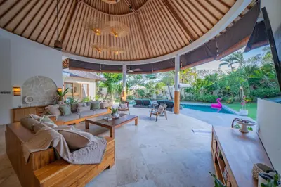 an open living room with couches and a pool at Villa Lea - 5BR luxury oasis in Seminyak with pool in Kerobokan