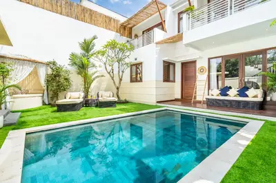 a swimming pool in the backyard of a villa at Villa Gea by JB Villas in Seminyak
