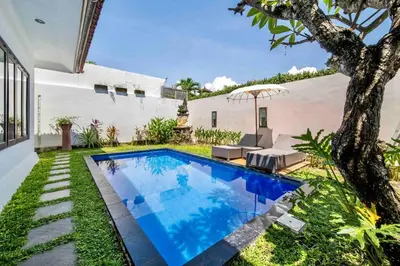 a swimming pool in the backyard of a house at Bens Seminyak Villa Two-Bedroom with Private SwimmingPool in Seminyak