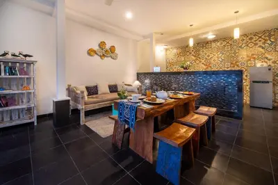 a living room with a table and a couch at Bens Seminyak Villa Two-Bedroom with Private SwimmingPool in Seminyak