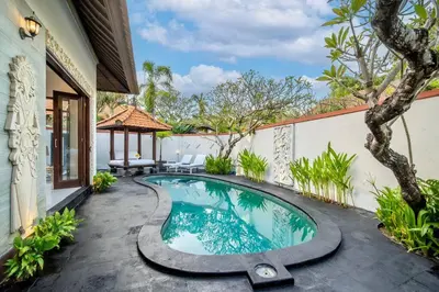 a swimming pool in the middle of a yard at Bens Bidadari Villa Two-Bedroom with Private Pool Kuta in Seminyak
