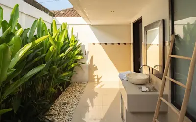 a bathroom with a sink and some plants at Gemstones Villa in Seminyak
