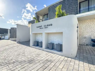 a store with three trash cans on the side of a building at Saint Cloud Villa Umalas in Canggu