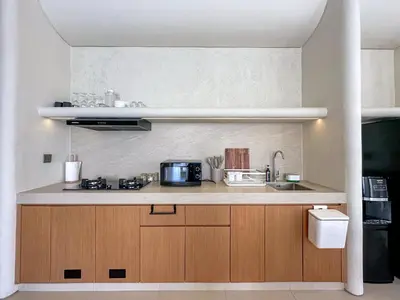 a kitchen with a counter top with a microwave at Saint Cloud Villa Umalas in Canggu
