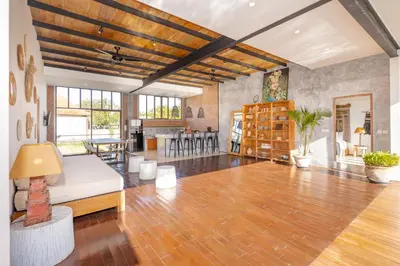 a living room with a couch and a table at Villa Anzo by DreamAwayBali in Seminyak