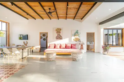 a living room with a couch and a table at Villa Anzo by DreamAwayBali in Seminyak