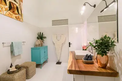 a bathroom with a sink and a blue cabinet at Villa Bloom 3 - Coastal Beach Villa 2 brm Sleeps 4 SEMINYAK BEACH in Seminyak