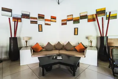 a living room with a couch and a table at Timang Villa, Jimbaran-Bali in Jimbaran