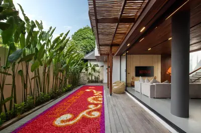 an open hallway with a red and yellow carpet at Oza Villa Canggu Managed by LEAD in Canggu