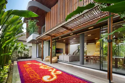 a house with a red rug on the floor at Oza Villa Canggu Managed by LEAD in Canggu