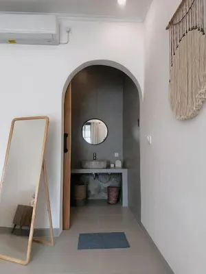 a bathroom with a mirror and a sink at Private Pool Seminyak Central 2BR Villa in Seminyak
