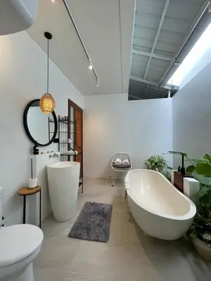 a bathroom with two white tubs and a sink at New 2BR Villa Private Pool Near Seminyak in Kerobokan