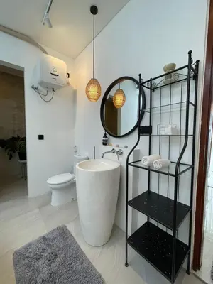 a bathroom with a tub and a sink and a mirror at New 2BR Villa Private Pool Near Seminyak in Kerobokan