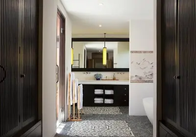 a bathroom with a sink and a mirror at Villa Mamoune in Canggu